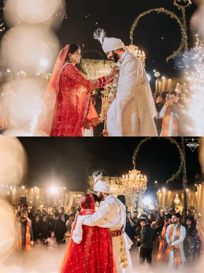 A magical Varmala exchange, illuminated by sparklers and surrounded by loved ones. I focus on capturing the atmosphere of the moment, from the grand pyrotechnics to the intimate embrace.