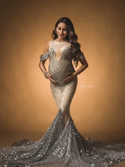 A full-length portrait in a spectacular silver-sequined gown. This is for the mama who wants to go all-out with glamour for her maternity shoot.