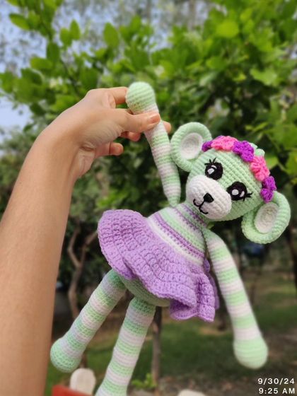 This monkey doll is ready for a dance with its fun, dangly legs.