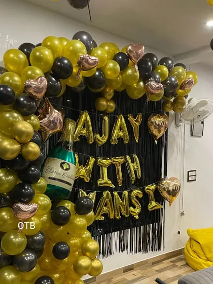 Another view of the black and gold anniversary decor, showing how it creates a fun and personalized party corner.