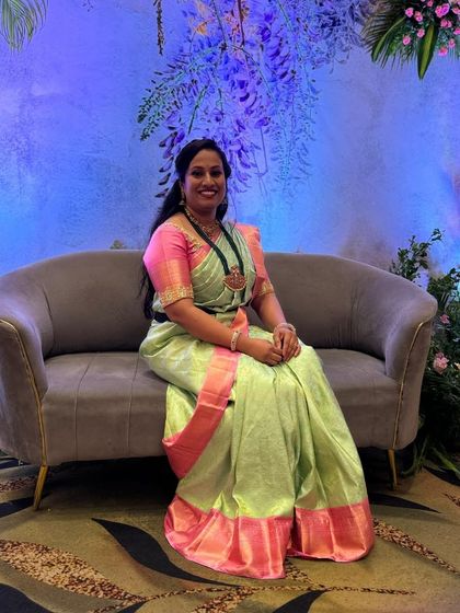 Navyashree radiates elegance in this gorgeous silk saree, featuring a striking contrast of pretty pink and green pastels.