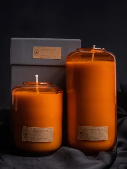 Our Volumetric Curve candles in a rich, warm orange hue. Available in two sizes, these sleek, modern candles are perfect for adding a pop of color and a touch of minimalist style to your decor.