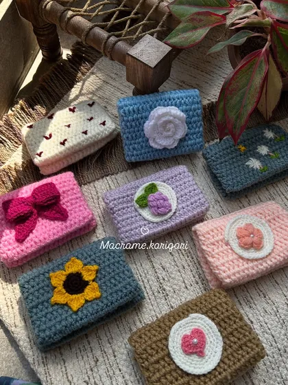 Our collection of mini crochet card wallets, each with a unique, adorable design. From sunflowers to hearts, these wallets are perfect for carrying your essential cards and a little cash.