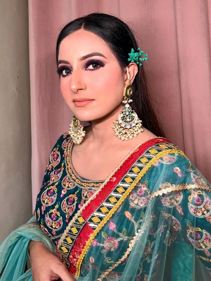 This look is all about the details. The green hair accessory picks up the colors in her beautiful outfit.