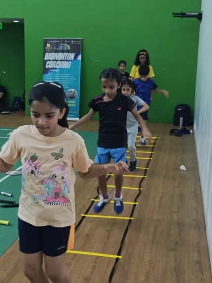 Agility is key in badminton. Here, my young students work on their footwork and coordination using agility ladders, a fun and essential part of our fitness routine for kids.