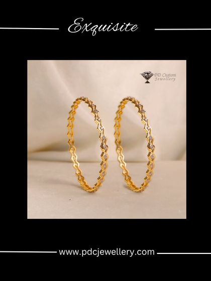 An exquisite pair of 18kt hallmarked diamond running bangles. The delicate zig-zag pattern gives these bangles a modern and stylish edge.