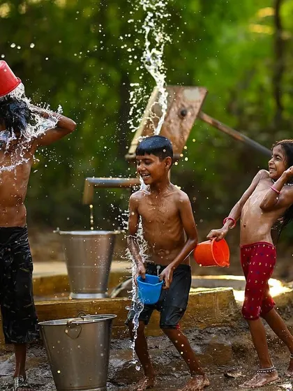 A moment of pure chaos and fun as water flies in every direction. The smiles on the children's faces show the simple happiness found in beating the summer heat together.