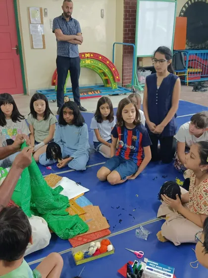 I am showing the students how to drape a saree on a puppet. It is a great way to teach them about both puppetry and Indian culture.