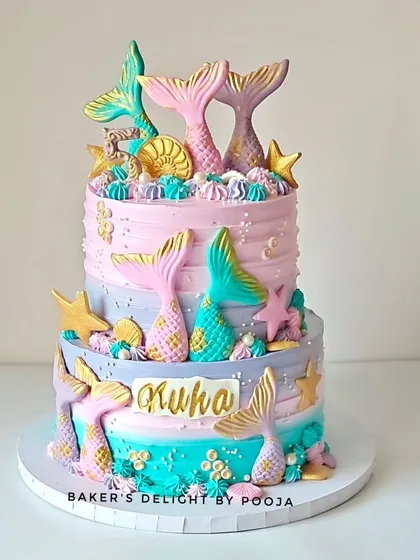 The full view of the two-tier pastel mermaid cake, showcasing the intricate details and soft color palette that made it a hit.