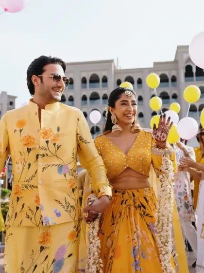 The couple makes a grand entrance to their Haldi, walking through an aisle of friends holding balloons. I love creating interactive and fun entries that involve the guests.
