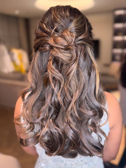 A close-up of the twisted half-updo, showing the beautiful texture and highlights in the hair.