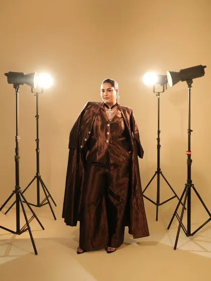 A full-length shot of Sakshi Sindwani, showing the complete look with the Manish Malhotra outfit. The makeup is powerful and chic.