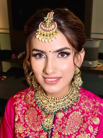A classic look with a natural finish. I paired a defined eye with a neutral pink lip and an elegant updo, allowing the stunning traditional jewelry to shine.