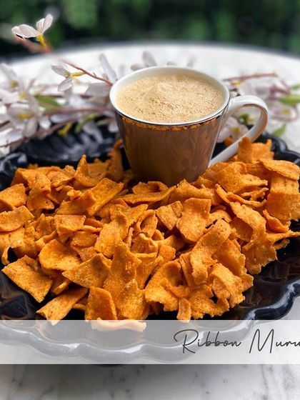 My Ribbon Murukku contains besan, rice flour, hing, garlic, red chillies, and salt. It's a crispy, savory, and light snack.