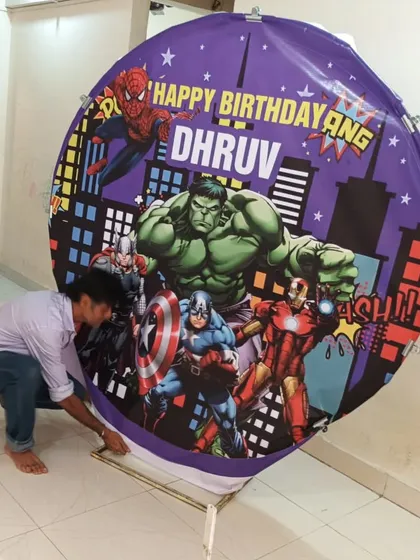 Me putting the final touches on the Avengers theme backdrop cloth.