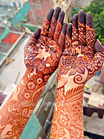 The beautiful, deep reddish-brown stain of my natural henna paste, captured in the sunlight. This is the result after the paste has been removed, showing the quality and richness of color you can expect for your special day.