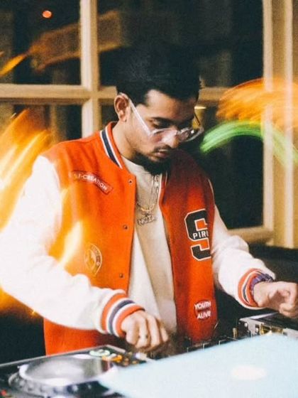 A long exposure shot capturing the motion and energy of my performance. I am always moving, mixing, and interacting to keep the vibe dynamic.