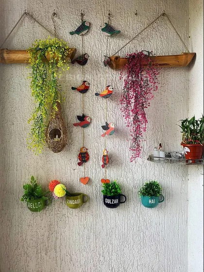 "Hello! Zindagi Gulzar hai!" This charming balcony decor setup is designed to be a happy corner, with cute planters and colorful hangings that bring a smile to your face.