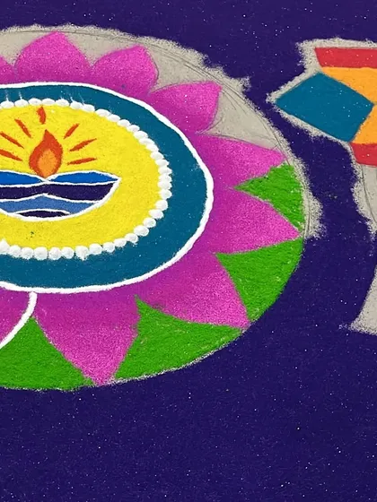 A detail shot of the diya and 'kandil' elements. The layering of colors within the diya flame and the geometric pattern of the lantern show the careful handiwork involved.