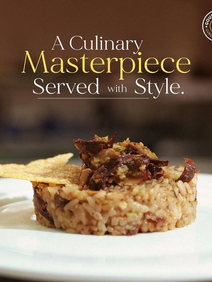 The same beautiful mushroom risotto, presented as a culinary masterpiece served with style. This dish is a testament to our commitment to excellence.