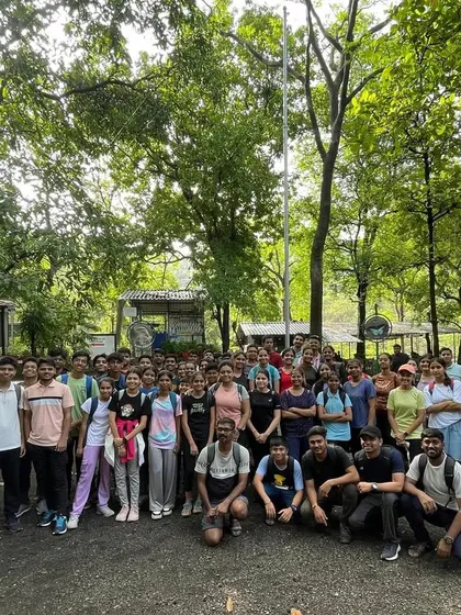 The entire team, including over 60 shooters and coaches, posing for a group photo during our traditional Karnala Fort trek. This outing is a long-standing tradition that builds team spirit outside the range.