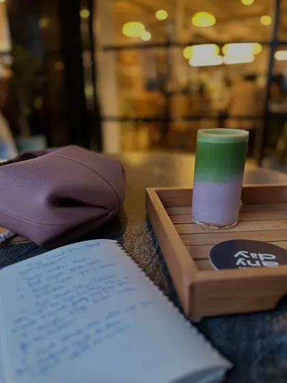 Life lately: slow days, matcha, and a whole lot of love. A flat lay of my journal and a pretty drink.