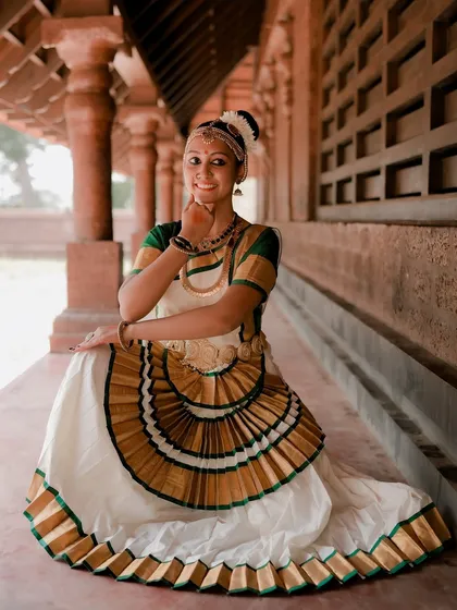 A duplicate of image 17, this portrait of a Mohiniyattam dancer captures the grace of the pose and the beauty of the traditional costume.