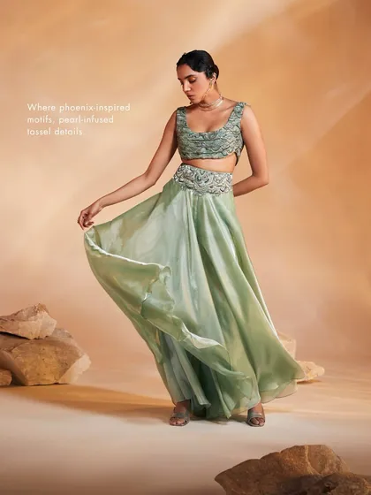 The Adoree set without its cape, revealing the hand-adorned bustier and swirl-worthy flared pants, showcasing the versatility of the ensemble.