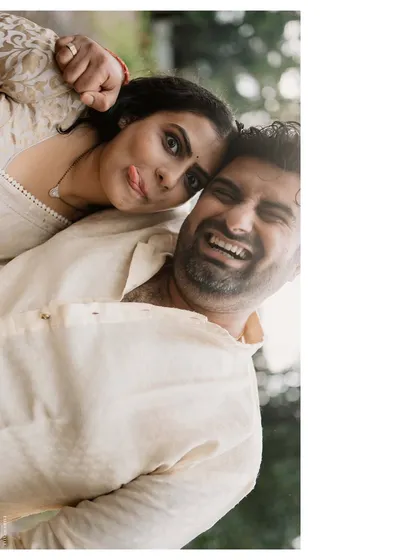 A playful, tilted shot that captures their fun-loving personalities. It’s a quirky, happy moment that shows the lighter side of their love story.
