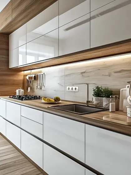 I designed this modern modular kitchen with a clean, linear aesthetic. It features high-gloss white laminate cabinets for a bright feel, paired with warm wood textures and under-cabinet LED lighting for a practical and stylish cooking environment.