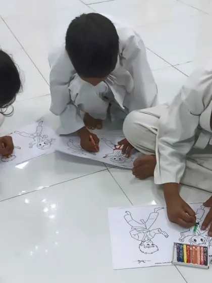 After a session of focused training, we have our joy time. Here, my karatekas are enjoying a coloring activity together. I believe in balancing discipline with fun to nurture creativity and build strong friendships within the class.