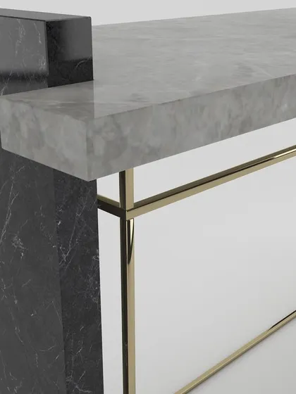 A close-up of the junction between the grey marble top, black marble leg, and the thin metal frame, highlighting our precision craftsmanship.
