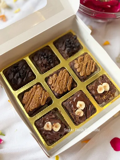 An assorted brownie bites box for Diwali, with a mix of chocochip, Nutella, and Lotus Biscoff flavors.