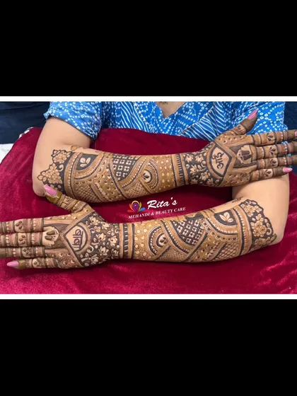 The back of the hands for a baby shower mehendi, featuring simple yet elegant patterns.