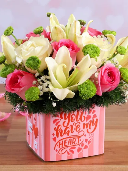This modern box arrangement is one of my most popular romantic gifts. It features soft pink roses and elegant white lilies with fresh green accents, all beautifully presented in a "You have my heart" themed box, ready to make someone's day.