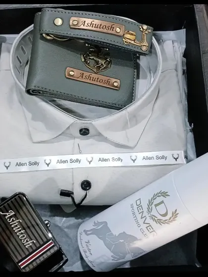 This premium gift hamper includes a personalized wallet, keychain, and belt, along with a branded shirt and deodorant.