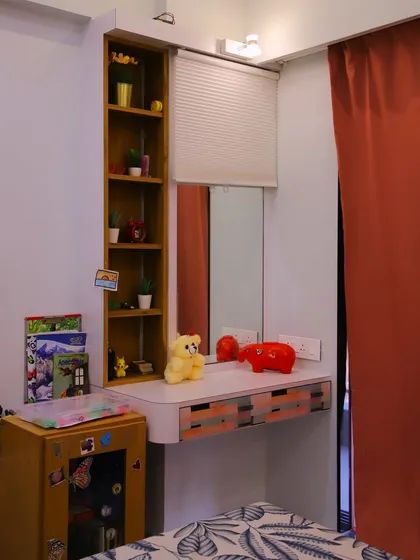 This image captures the cozy and personalized feel of the study nook, complete with a teddy bear and colorful decor.