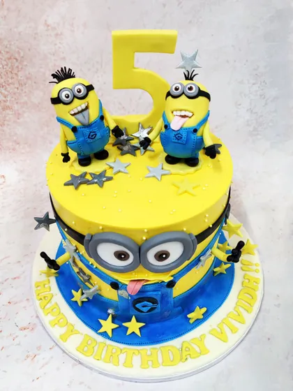 Our 3D Minions Cake brings the mischief to life with two expressive minions on top and a large minion face wrapping around the cake itself.