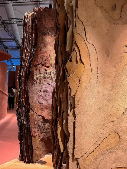 Layers of earth-like textures in the 'Soil' installation. The torn and overlapping surfaces suggest geological formations and the passage of millennia.