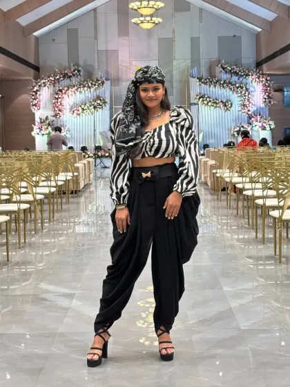 A frontal shot of my zebra-print top and dhoti pants, a bold and stylish choice for a contemporary wedding reception.