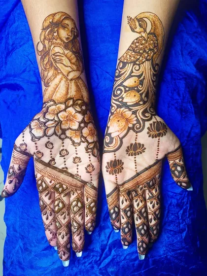 A fun practice piece combining some of my favorite things to draw. One hand features a whimsical portrait of a girl, while the other has a majestic peacock and lotus design.
