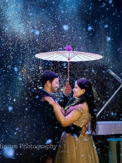 Imagine a romantic moment under the stars, captured in our special artificial rain setup. This unique effect, combined with the elegant piano prop, creates a truly magical and cinematic pre-wedding photograph.