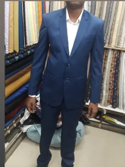 Here is a client trying on his new two piece suit right here in my Gurgaon shop. I personally ensure the fit is perfect across the shoulders and the drape of the trousers is just right, so you leave feeling confident in your new bespoke attire.