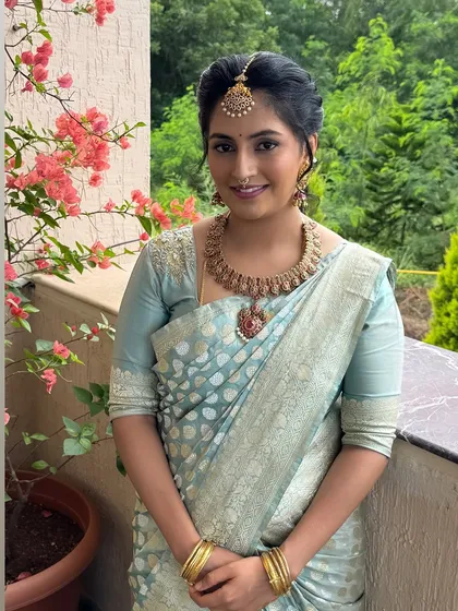 A naming ceremony calls for a fresh and elegant look for the new mom. Here, I created a soft, daytime-appropriate style with a simple updo that felt special yet effortless for this important family occasion.