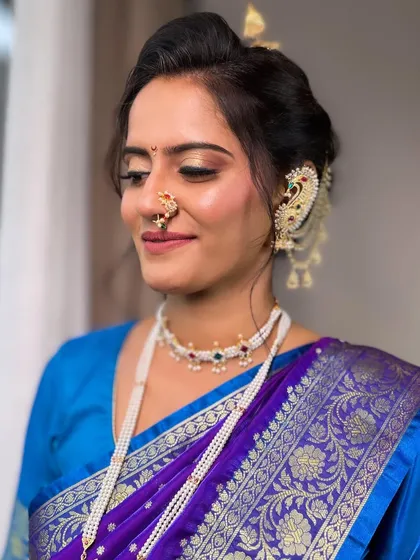 My bride looking serene and beautiful for her Punyavachan ceremony. The makeup is designed to be both traditional and long-lasting.