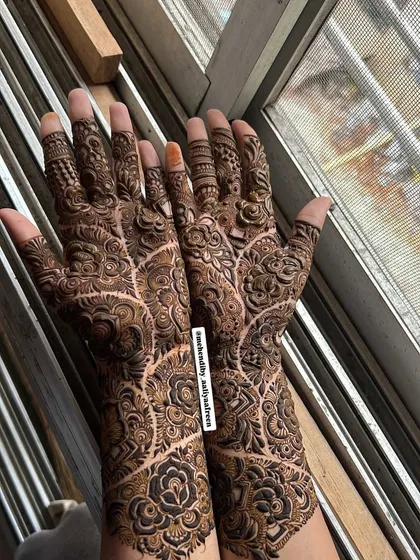 A super detailed and dense design, filling the hands with intricate linework and shading.