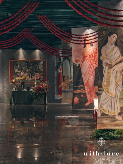 The grand entrance corridor, with paintings on either side leading guests into the main event space. The journey into the sangeet is as beautiful as the destination.