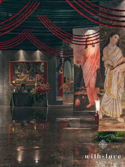 The grand entrance corridor, with paintings on either side leading guests into the main event space. The journey into the sangeet is as beautiful as the destination.
