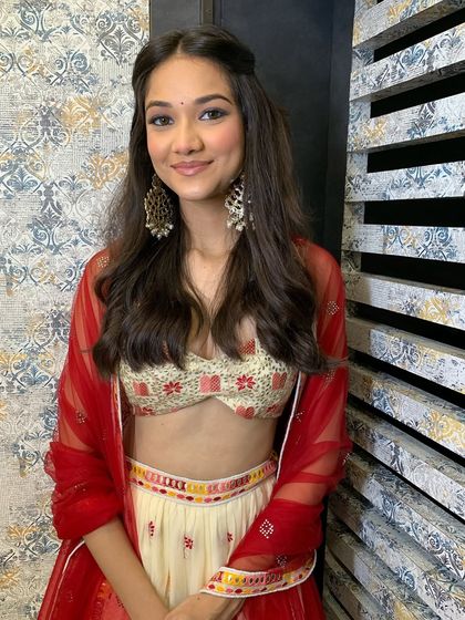 Another modern look, this time with a pop of red. The makeup is kept natural to let the outfit shine.