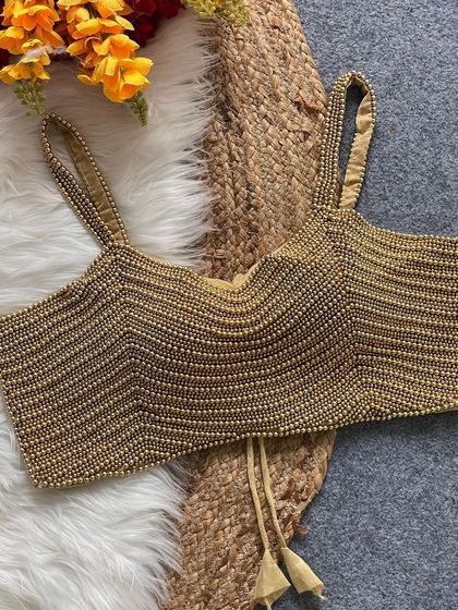 My pearl moti spaghetti blouse in a beautiful golden shade, perfect for festive occasions.